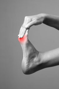 Patient holding injured foot