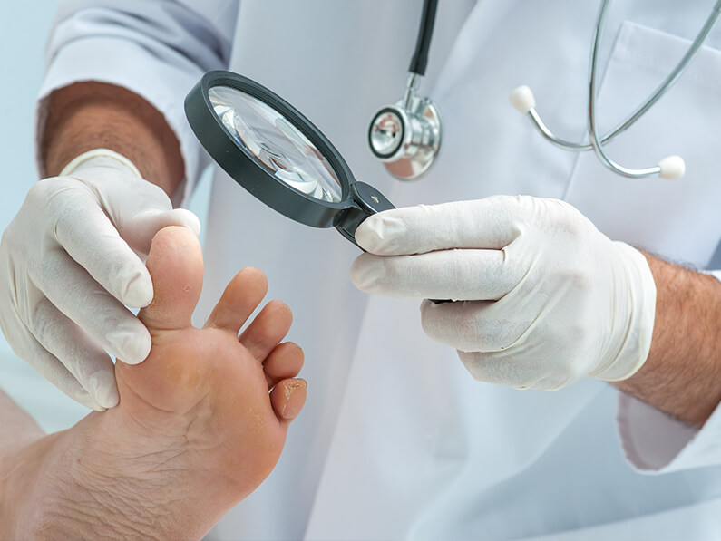 Dr. Michael Salcedo examining a patients foot