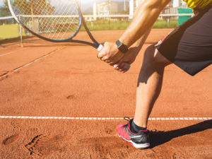 Tennis player enjoying rousing match of outdoor sport